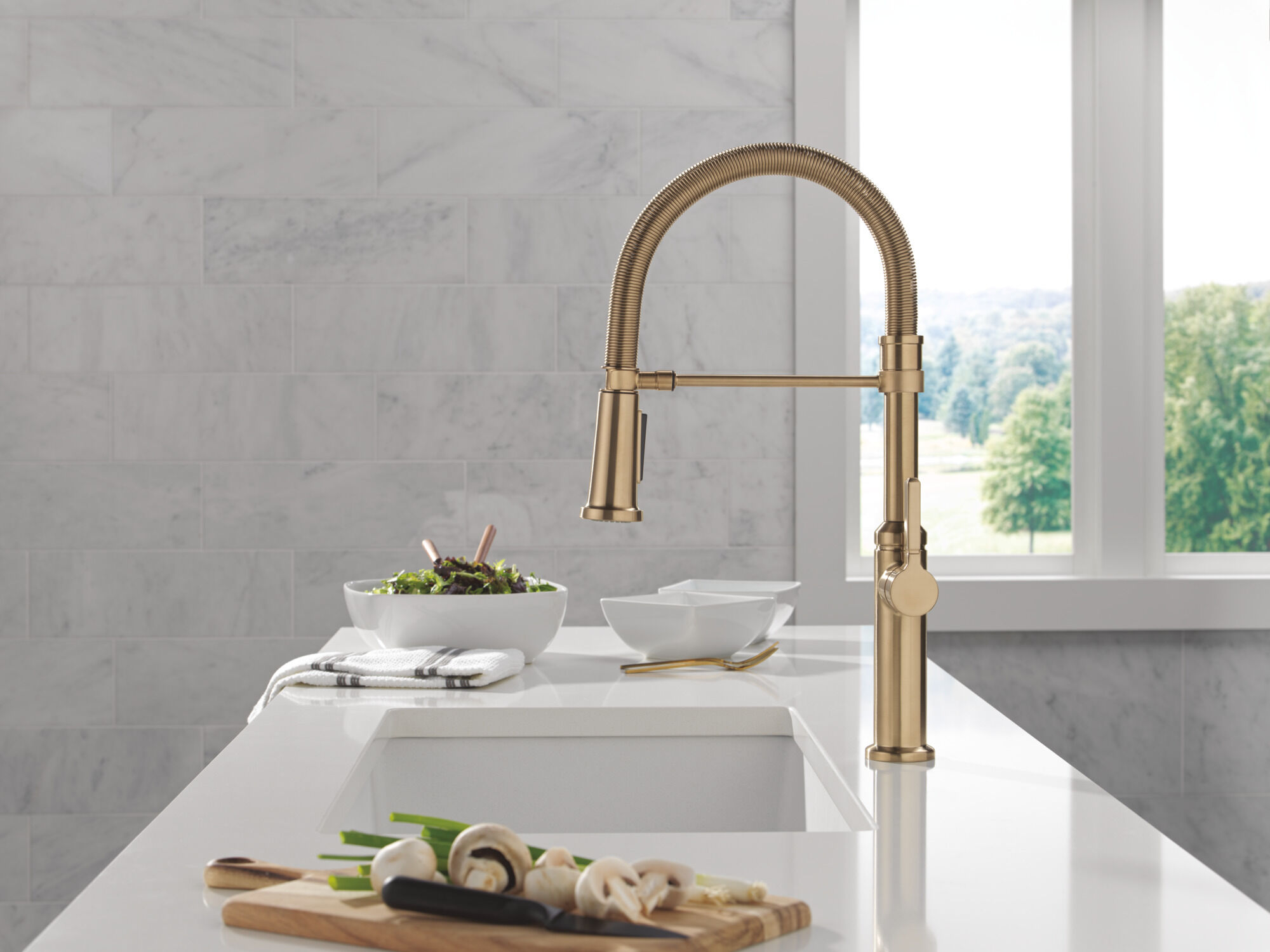 Single Handle Pull-Down Spring Kitchen Faucet in Champagne Bronze
