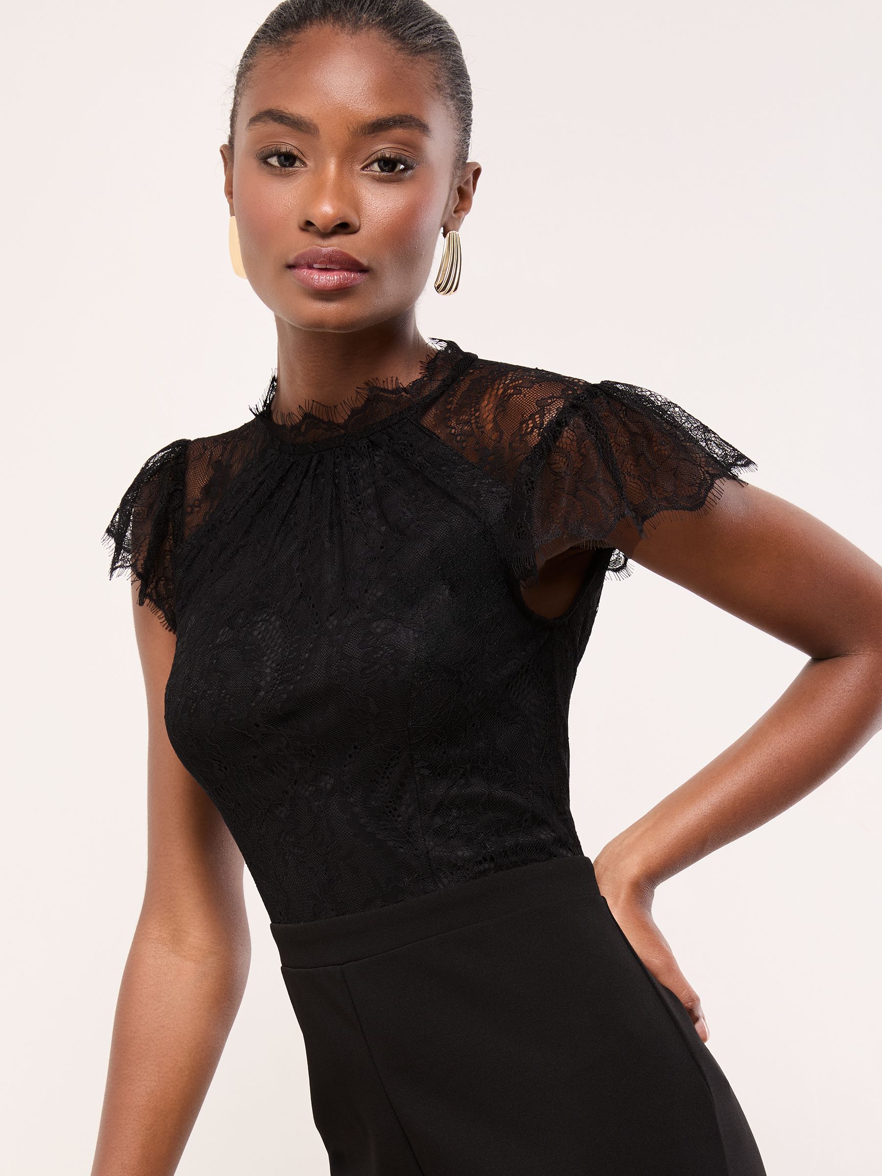Buy Lipsy Black Petite Lace High Neck Short Sleeve Jumpsuit from