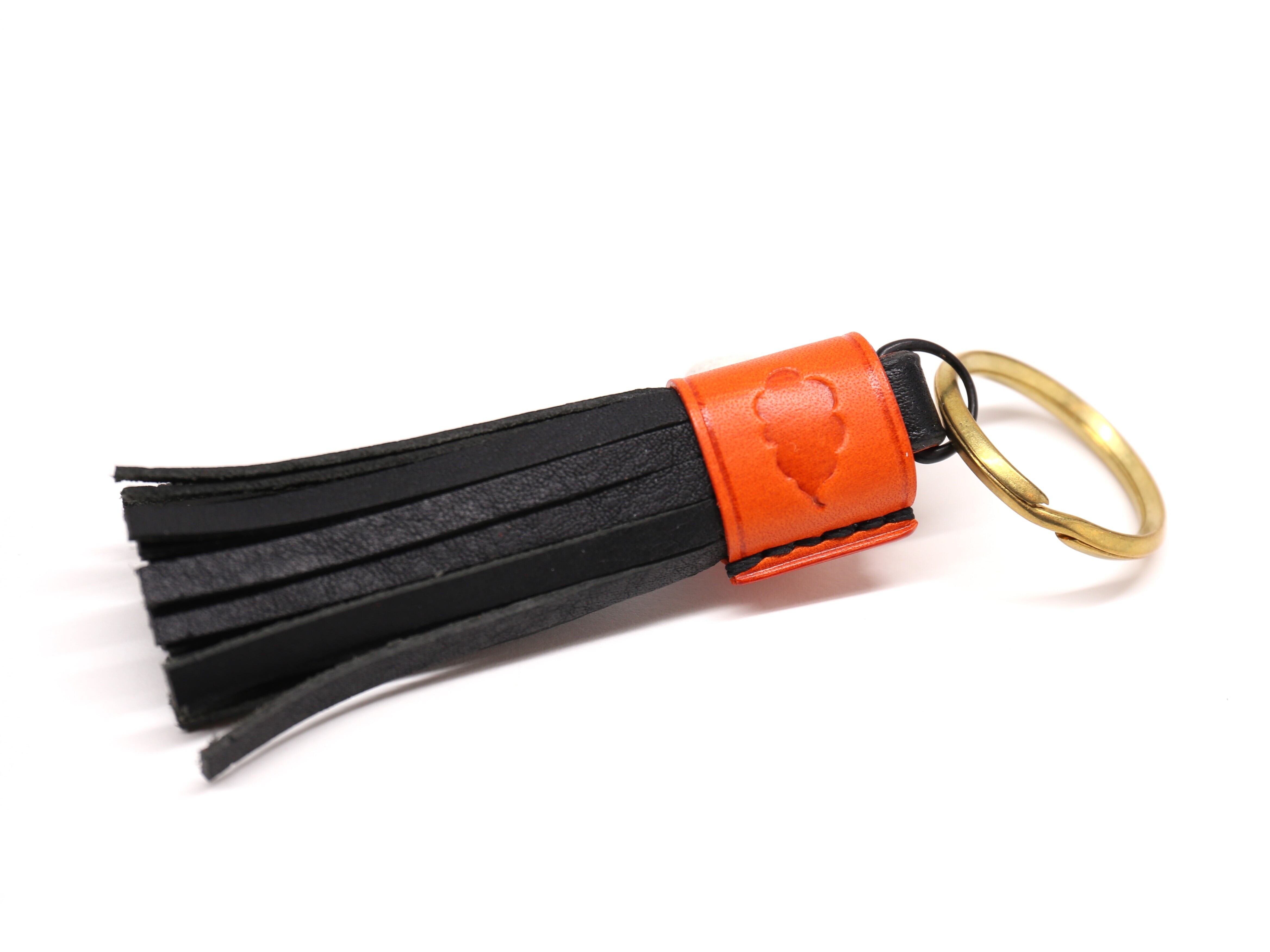 フリンジキーホルダー（オレンジ×ブラック）バイカラー仕様 | kumosan