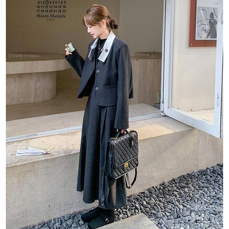 ユニークな襟デザインショートジャケットとロングスカートの