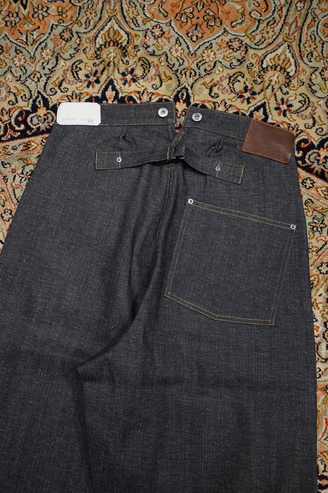 Taiga Takahashi(タイガタカハシ)のBUCKLE-BACKED DENIM TROUSERS(RAW