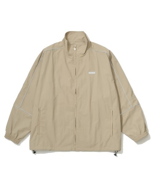 KEBOZ（ケボズ）の「REFLECTOR PIPING NYLON TRACK JACKET（ナイロン
