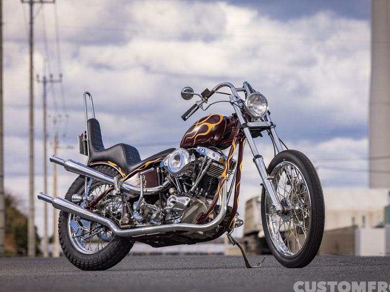 インディアンオレンジモーターサイクルのハーレー FXE 1976年の