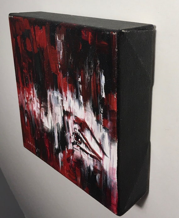 目のある赤と黒の抽象画のミニチュア絵画、インスピレーションを与える