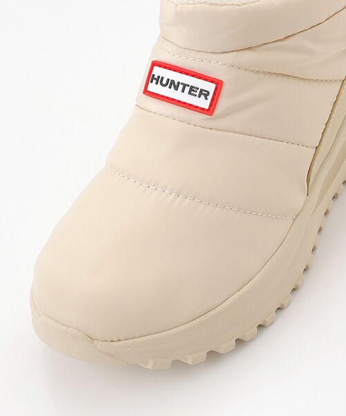 セール】 ユニセックス パフド トラベル フロー トレーナー