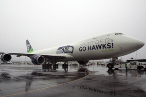 Seahawks 747 flies number 12 pattern over Washington state