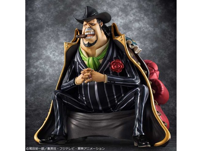 不敵な笑みを浮かべて座る「カポネ・“ギャング”ベッジ」のフィギュア