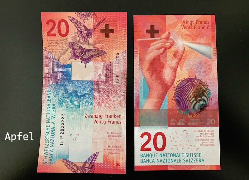 新しい20フランとカラフル第二の紙幣 : スイスの街角から