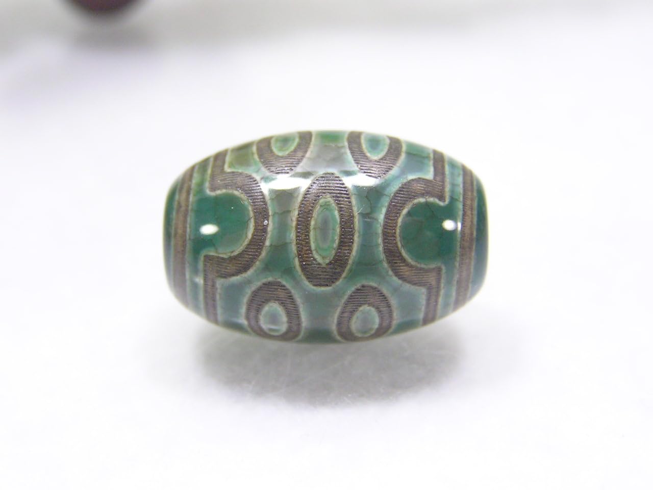 Amazon.co.jp: チベット天珠 緑色の龍紋 七眼天珠(なながんてんじゅ