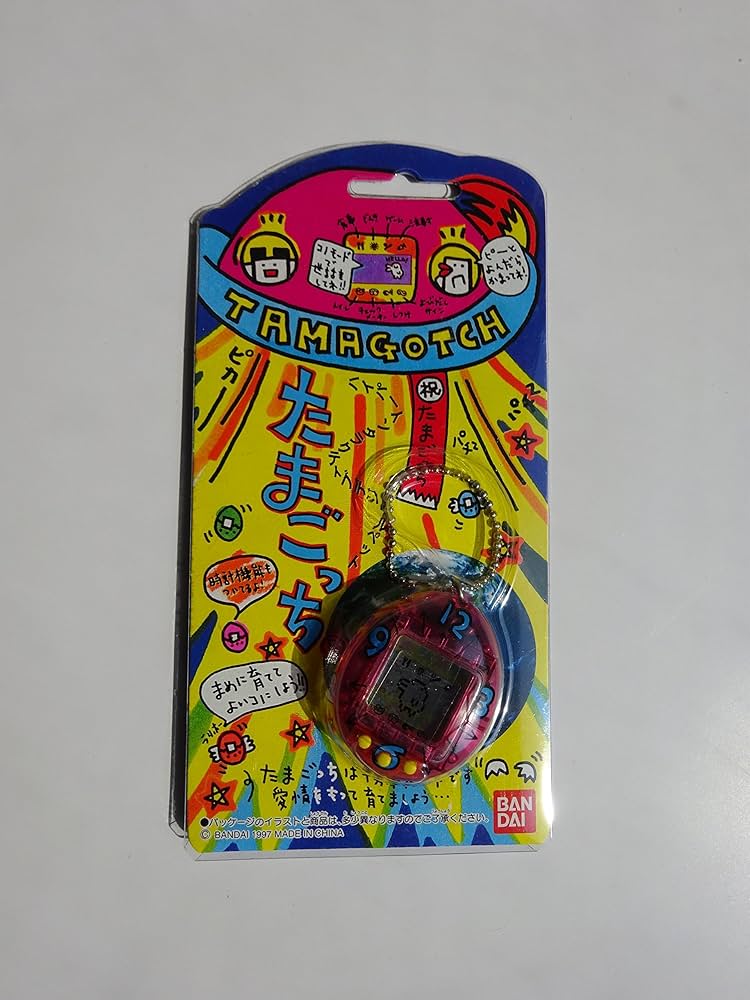 Amazon.co.jp: バンダイ 初代 たまごっち スケルトンピンク色（時計柄