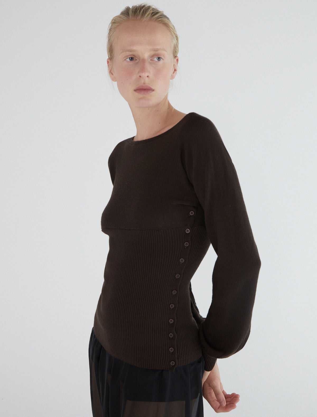 FA-Flat cross-shaped top with buttons along the sides and sleeves
