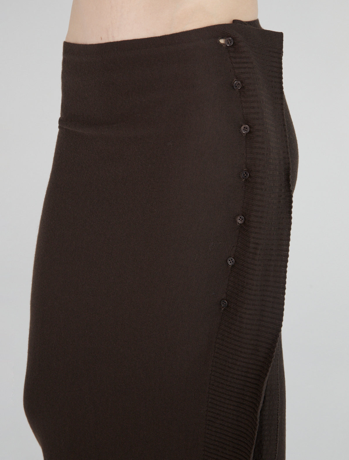 CHARCO-Wrap skirt, featuring side buttons for opening and closure