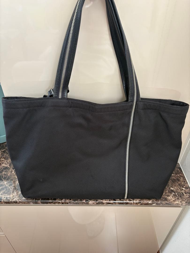 TUMI 30周年記念トートバッグ トゥミ ブラック - メルカリ