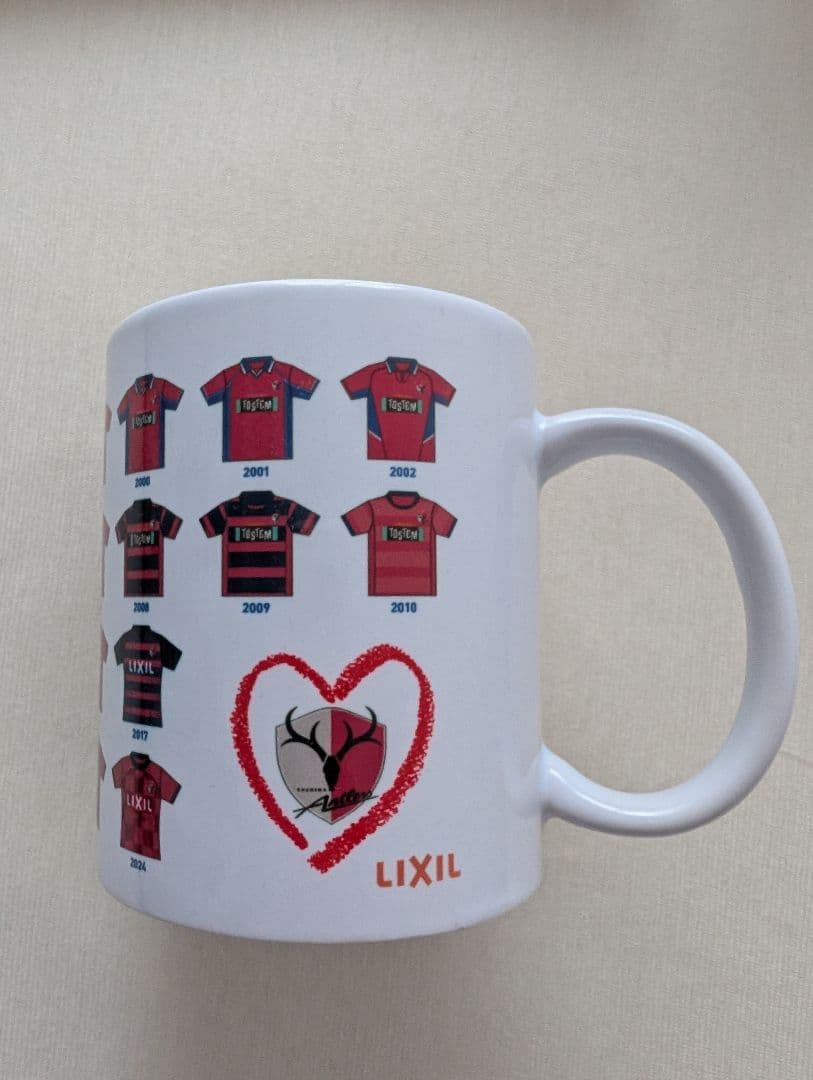 鹿島アントラーズ×LIXIL協賛30周年記念マグカップ&タオル - メルカリ