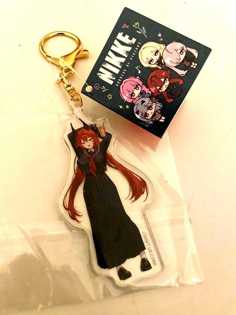 タイトー限定 NIKKE アクリルキーホルダー レッドフード - メルカリ