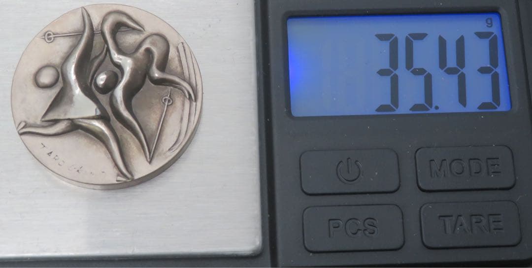 792、札幌オリンピック 純銀 刻印 メダル 岡本太郎 約35.43g - メルカリ