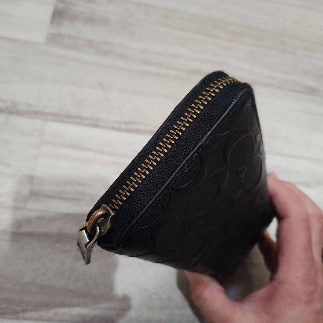 COACH エンボス加工 ブラック長財布 - メルカリ