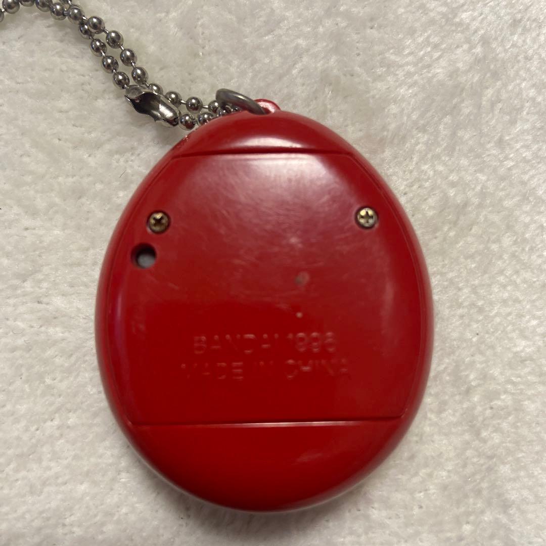 バンダイ 1996 初代たまごっち 赤色 ケースと説明書付 - メルカリ